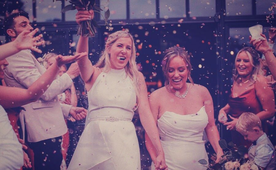 Throwing Confetti at the Brides